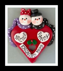 ENGAGEMENT ..SNOW COUPLE ON RED HEART