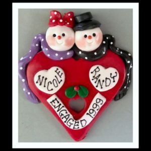 ENGAGEMENT ..SNOW COUPLE ON RED HEART